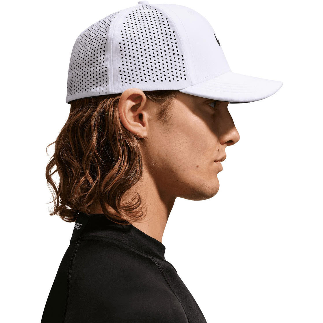 Nike Dri-FIT Advantage golf cap in White/Anthracite, worn, side profile