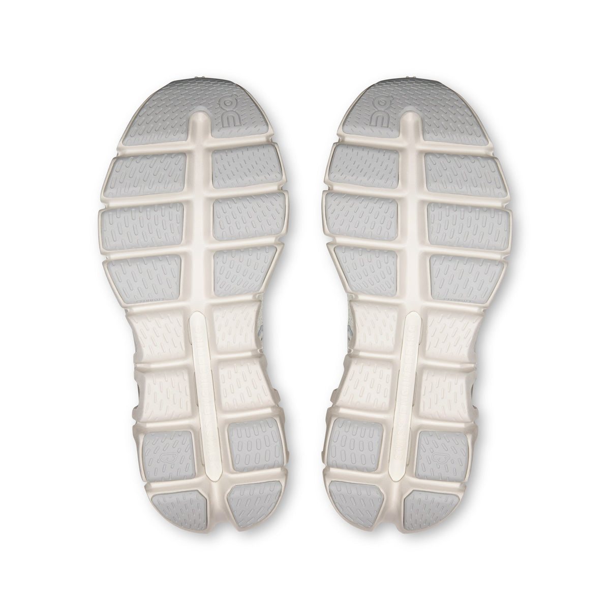 On Cloud X Tempo women's training shoe in Ivory/Ice, outsole of the pair
